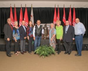 NOC received a bronze statue for their leadership and support of the Standing Bear Program.  Pictured (L-R):  President Clark Harris, Judy Poole, President Emeritus Tom Poole, President Emeritus Dr. Cheryl Evans, Carl Renfro, Brenda Renfro, Melinda Johnson, Chancellor Emeritus Glen D. Johnson, Tom Evans.  Not Pictured:  President Emeritus Dr. Joe Kinzer. (photo by John Pickard/Northern Oklahoma College)