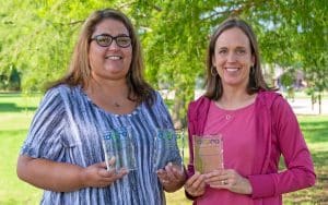 Northern Oklahoma College Printing Services earned three awards at the recent Oklahoma College Public Relations Association Awards reception held in Miami, Oklahoma. Dina Kleinmann (left) earned awards for T-Shirt Design and Logo Design while Paige Larson earned an award in Poster Design. (photo provided)