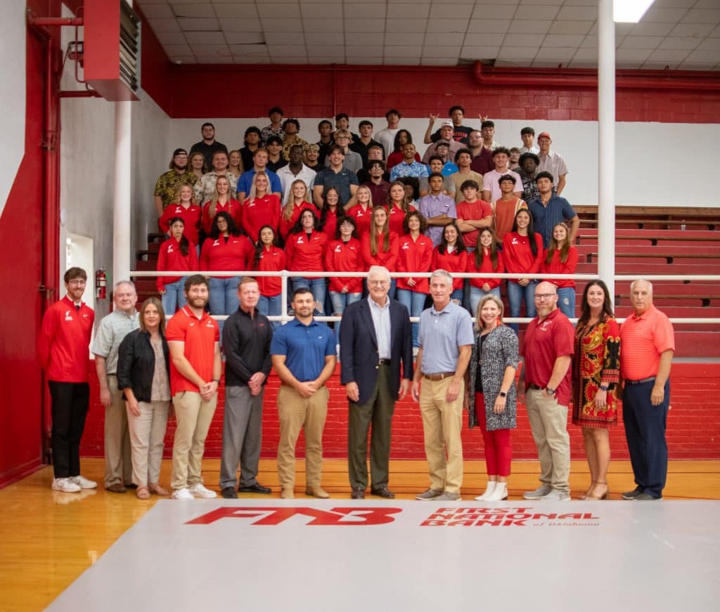 First National Bank of Oklahoma donated two new mats for the NOC wrestling programs.  Bank officers and NOC administration are pictured with members of the men’s and women’s wrestling programs.  (photo by Shiloh Martin/Northern Oklahoma College)