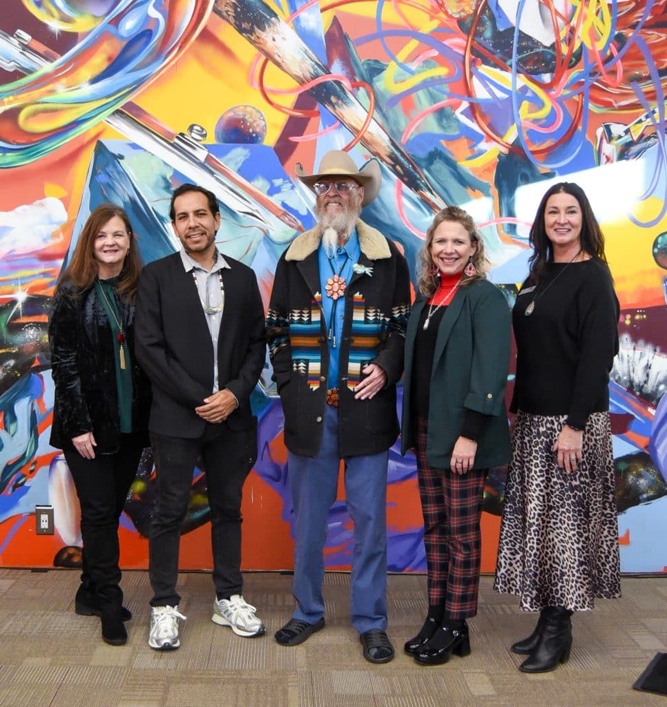 Over 50,000 square feet of murals were dedication on Dec. 11 at the NOC Tonkawa Cultural Engagement Center.  The murals, commissioned by Hugh Pickens, were created by Yatika Starr Fields. Pictured (L-R):  NOC President Emeritus Dr. Cheryl Evans, Yatika Starr Fields, Hugh Pickens, NOC President Diana Morris Watkins, Vice President for Development and Community Relations Sheri Snyder.  (Photo by Shiloh Martin/Northern Oklahoma College)