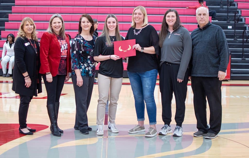 NOC student Lyndey Wilda received the Nevona Kegans Athletic Training Scholarship at Thursday’s Homecoming Basketball game against Eastern.  Pictured (L-R):  Director of Development and Donor Relations Candy Oller, NOC President Diana Morris Watkins, Stacy Wilda, Lyndey Wilda, HPE&R Division Chair Suzi Brown, Athletic Trainer Summer McClure, Athletic Director Alan Foster.  (photo by Shiloh Martin/NOC)