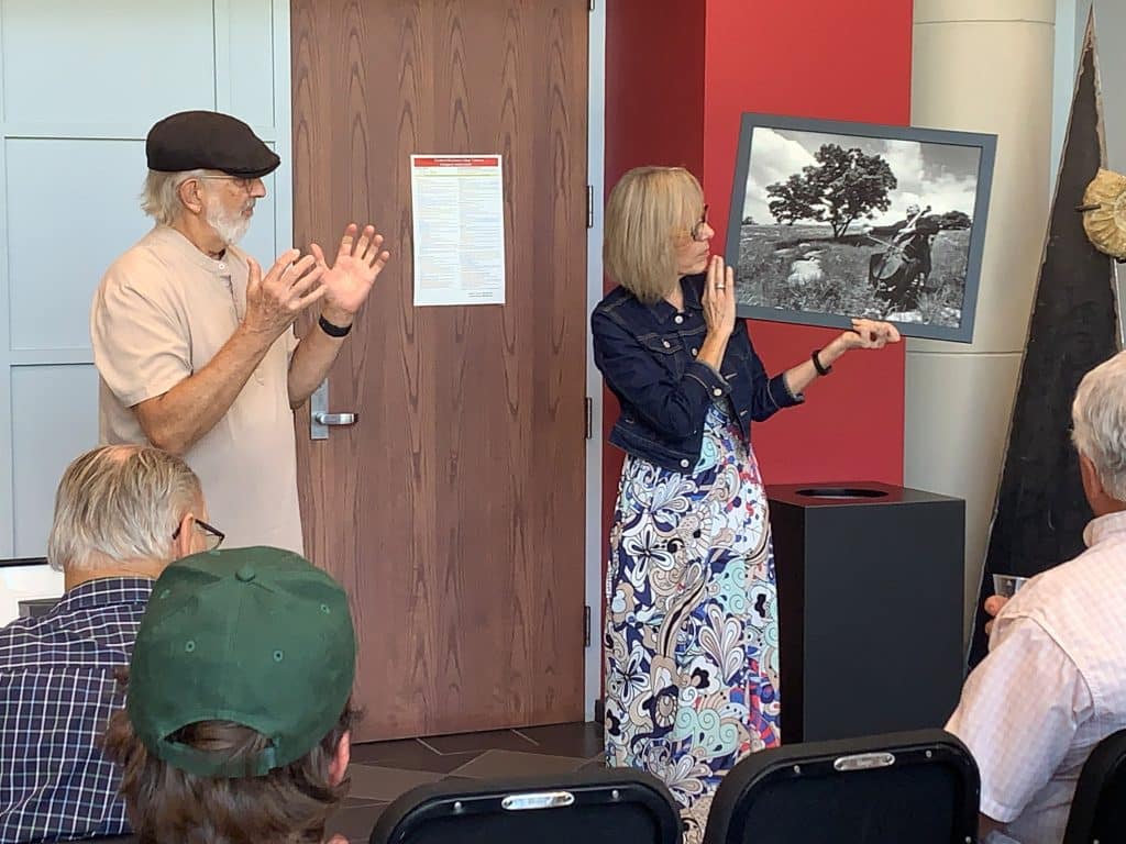 Tonkawa photographer Ken Crowder’s work is on exhibit at NOC Tonkawa’s Eleanor Hays Art Gallery through Dec. 12.  Crowder (left) explains some of his work, held by gallery director Audrey Schmitz.
