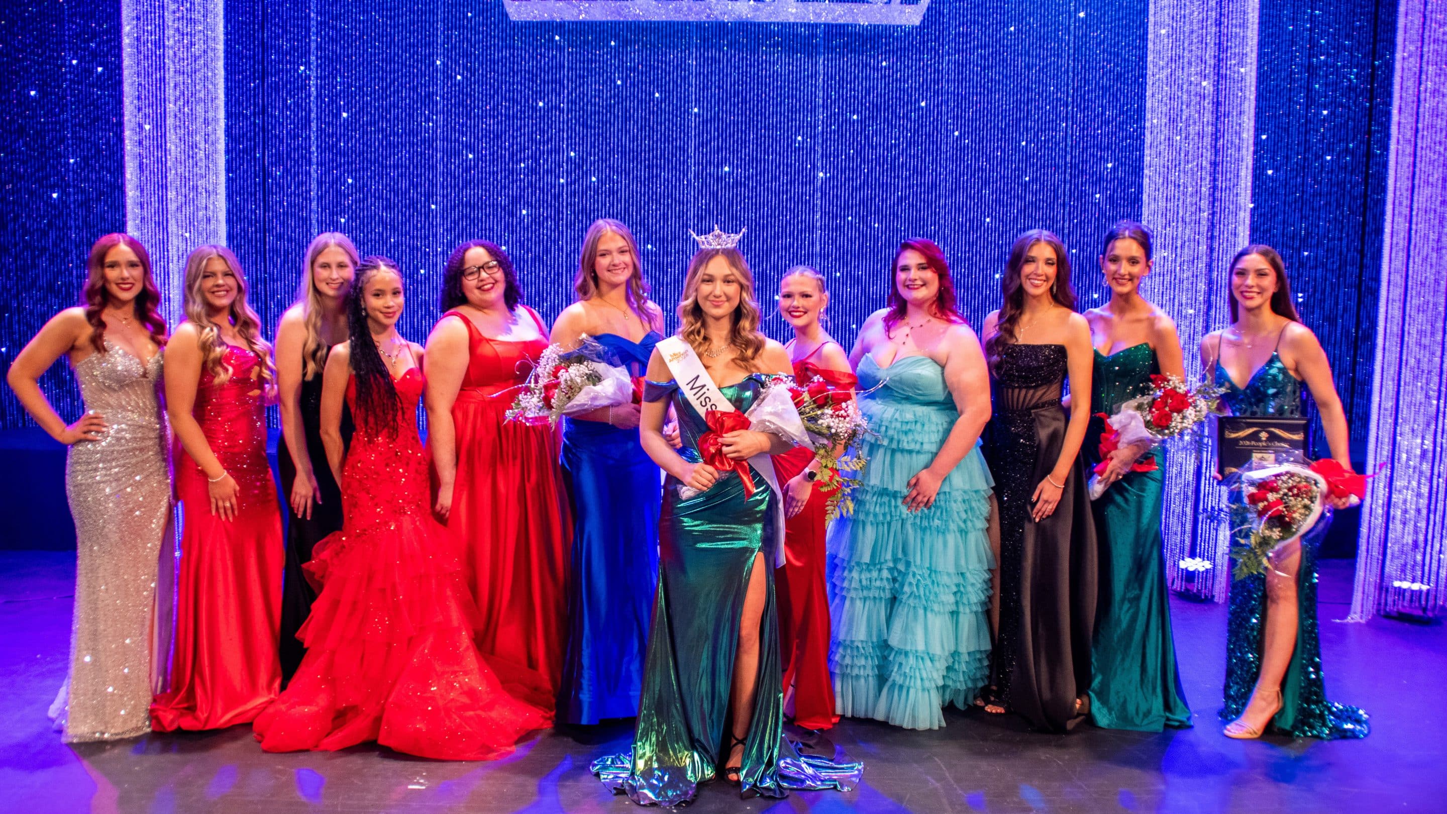 Miss NOC 2026 Alia Dust and the contestants.  Pictured (L-R):  Ella Branstetter, Ashley Schwarz, Haley Rutherford, Jordan DeLeon, Zion Moore, Hailey-Jane Holder, Staysha Cummins, Emelia Clarke, Jaclynn Heitman, Addison Kyler, Carlaeona Hockert.  (photo by Caroline Hillock/NOC)