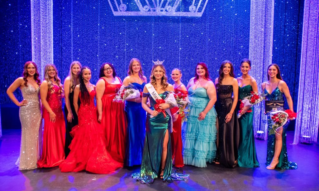 Miss NOC 2026 Alia Dust and the contestants.  Pictured (L-R):  Ella Branstetter, Ashley Schwarz, Haley Rutherford, Jordan DeLeon, Zion Moore, Hailey-Jane Holder, Staysha Cummins, Emelia Clarke, Jaclynn Heitman, Addison Kyler, Carlaeona Hockert.  (photo by Caroline Hillock/NOC)