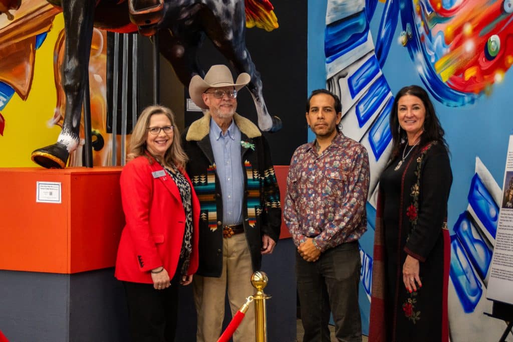 Pictured with the newly unveiled Ben Johnson statue at Northern Oklahoma College’s Pickens Learning Commons are (from left) NOC President Diana Morris, Hugh Pickens, artist Yatika Starr Fields and Sheri Snyder, NOC vice president for development and community relations. (photo by Caroline Hillock/NOC)