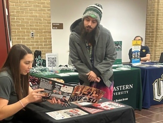 Photo of 2 people interacting