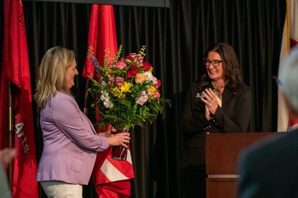 Retiring NOCF Treasurer Anita Simpson received a floral arrangement in appreciation for her years of service to the foundation.  (photo by Caroline Hillock/NOC).