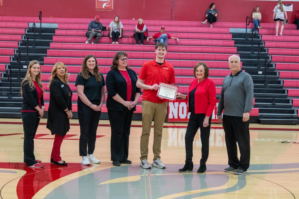 NOC Athletic Training student Heath Howell received the Nevona Kegans Athletic Training Scholarship on Feb. 26. Pictured (L-R): Kayla Wooderson, Director of Development and Annual Giving; Candy Oller, Director of Development and Planned Giving; NOC Athletic Trainer Summer McClure, Valerie Howell, Heath Howell, Nevona Kegans Bossert, and NOC Athletic Director Alan Foster. (photo by Caroline Hillock/NOC)