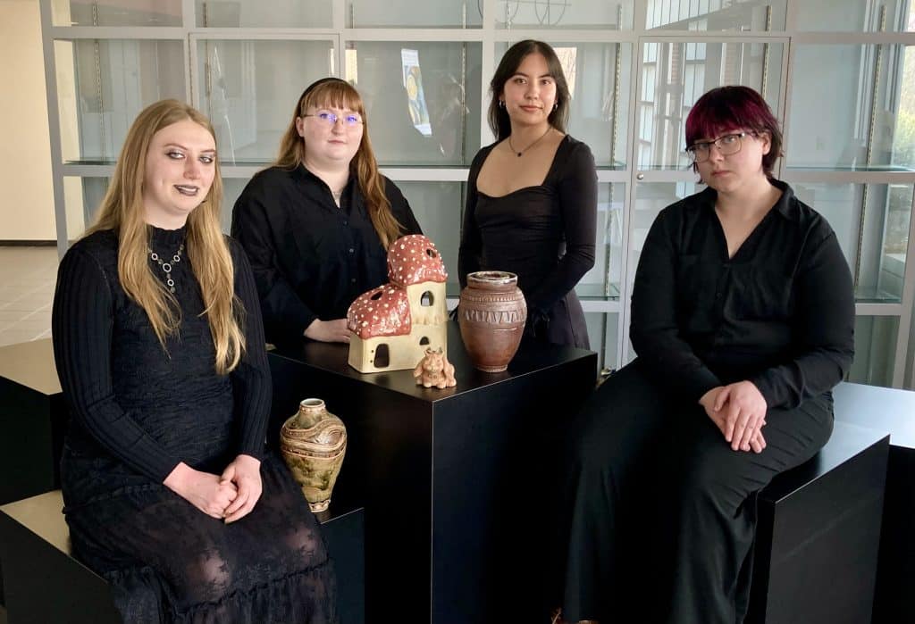 Northern Oklahoma College art students (from left) Delaney Fox, Wichita, Kansas; Neally Lantz, Stillwater; Macie Brophy, Ponca City; and Anna Jones, Medford, are featured in Beyond the Frame, the annual student art exhibition on view April 14-May 5 in the Eleanor Hays Art Gallery, NOC Tonkawa. A reception honoring all NOC student artists with work in the exhibit is set for 5 p.m. – 6:30 p.m. Saturday, April 18 in the art gallery. The exhibition and reception with refreshments is free and open to the public. (Photo by Audrey Schmitz)