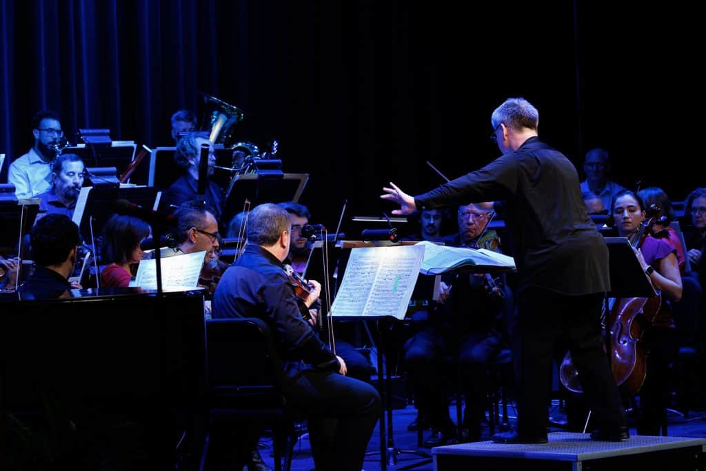Maestro Jerry Steichen leads the 56-member Gala Orchestra at the Quasquicentennial Concert Saturday night in Tonkawa. (photo by Mallory Kyler/NOC)